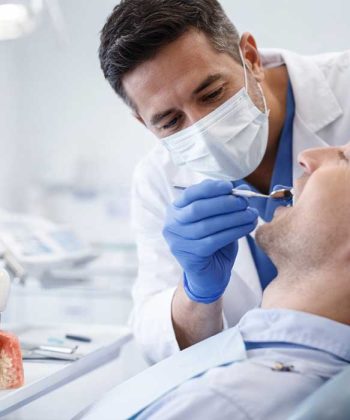 Dentist examining patient during a dental implant procedure in a modern clinic in Turkey